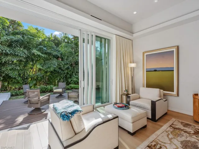 Tranquil lounge area in primary suite with private deck