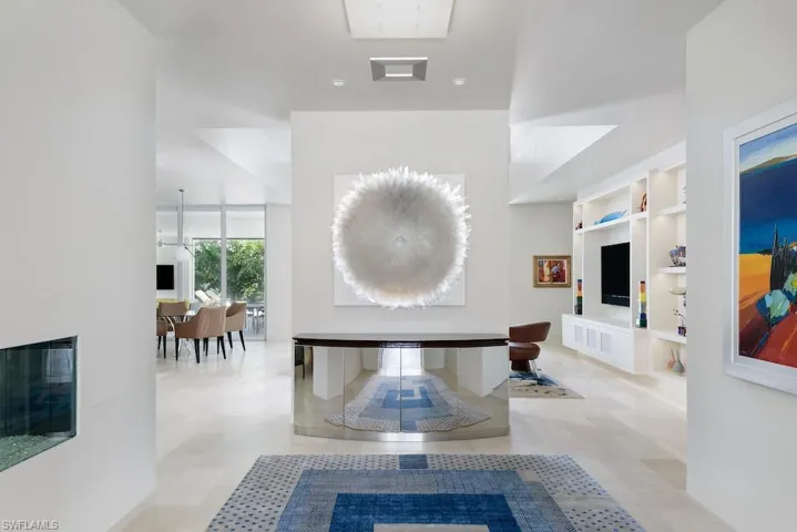 Foyer with see-through fireplace to living room