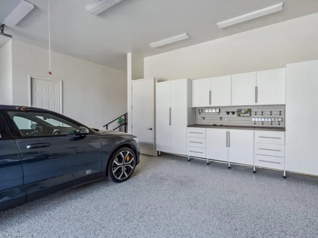 Oversized 2+ car garage with additional built-in storage cabinets