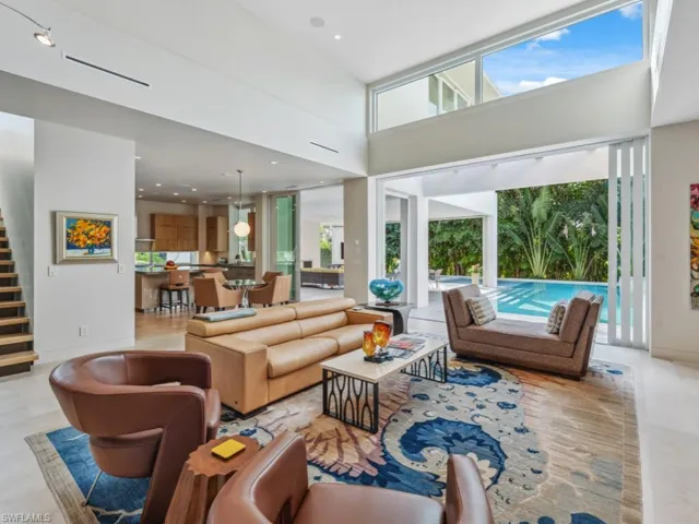 Great room featuring towering ceiling and an abundance of natural light