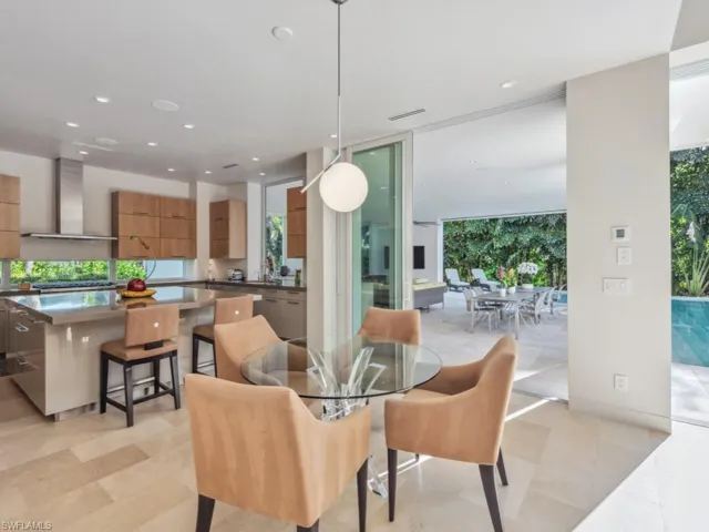 Eat-in kitchen table and view of outdoor lanai
