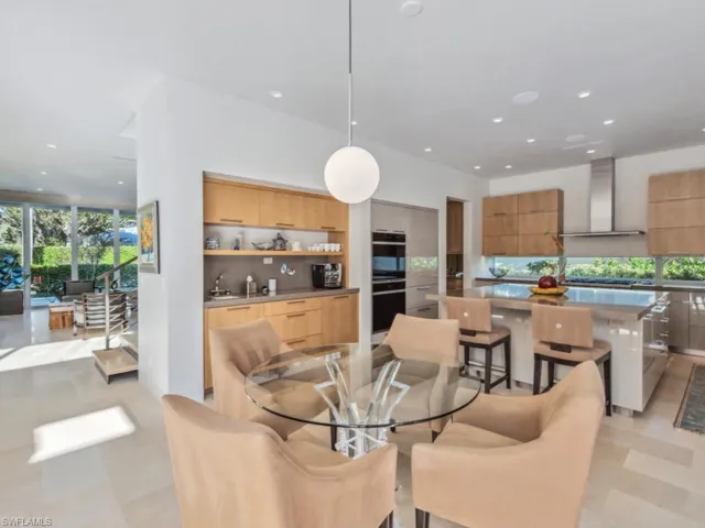 Eat-in kitchen table and view of coffee bar