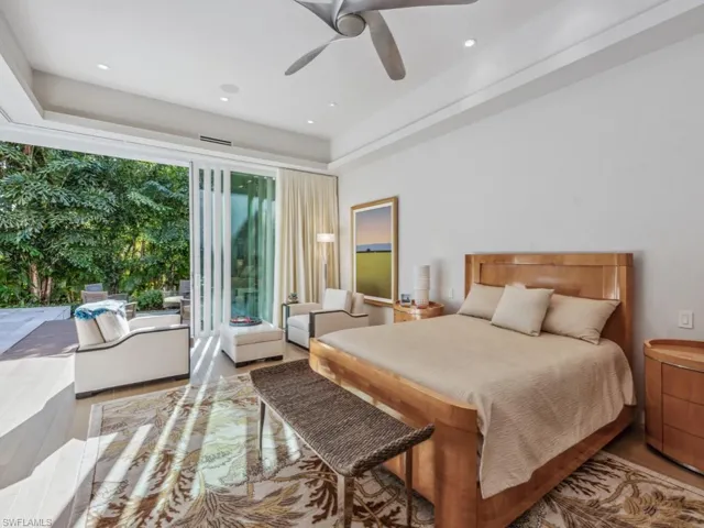 Primary bedroom with pocket sliding glass doors
