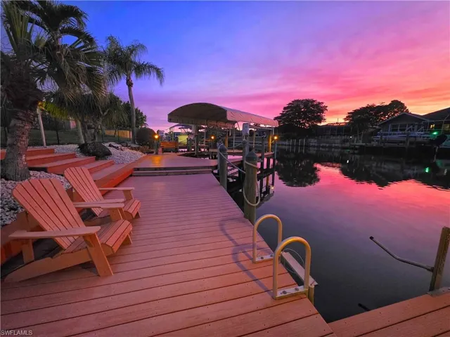 Dock area featuring a water view and boat lift