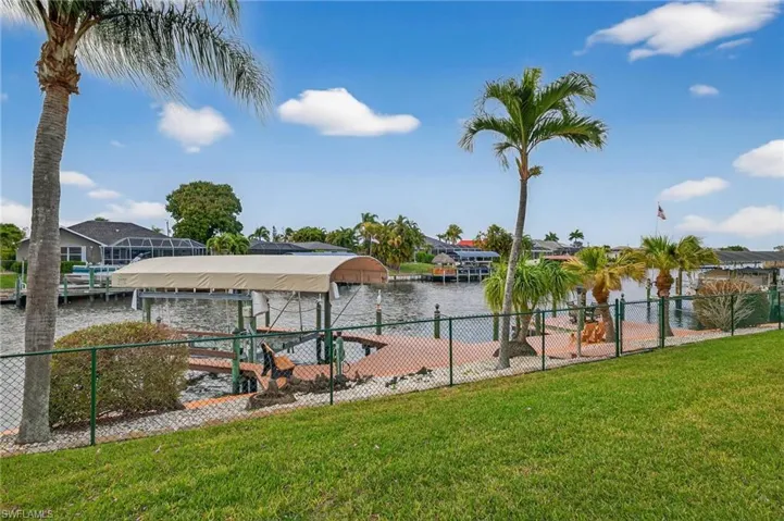 Dock with boat lift and a water view