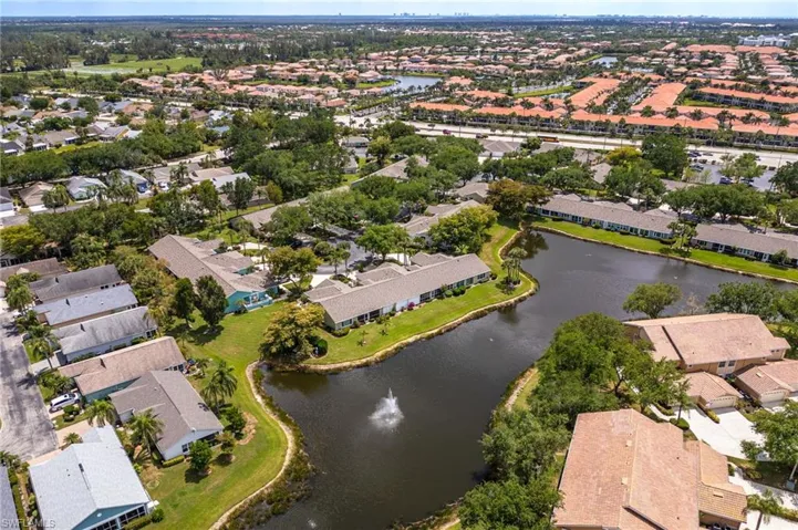 Aerial view featuring a water view and a residential view