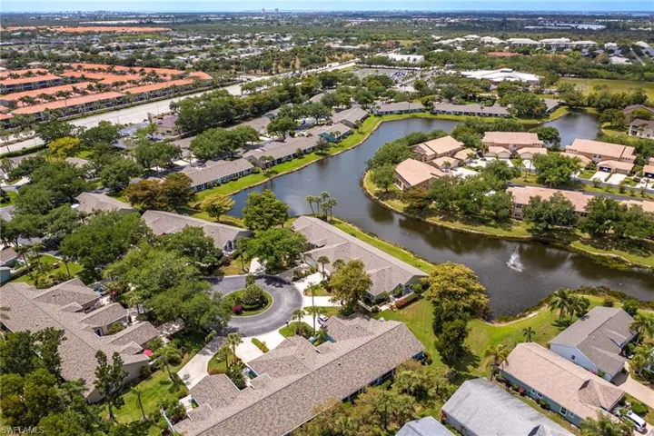 Aerial view with a water view and a residential view
