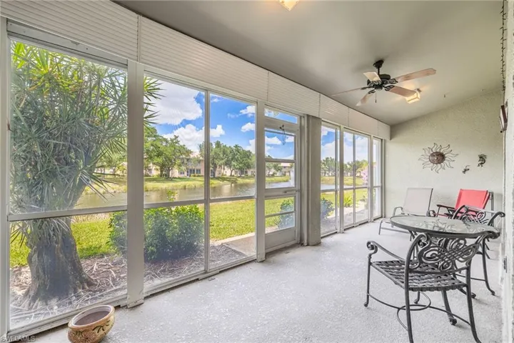 Sunroom / solarium featuring a ceiling fan