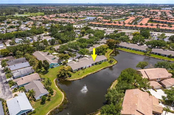 Birds eye view of property featuring a residential view and a water view