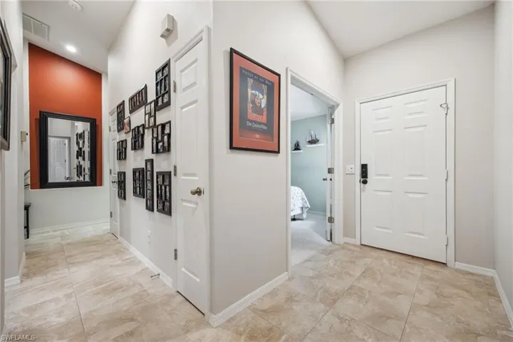 Hallway with visible vents and baseboards