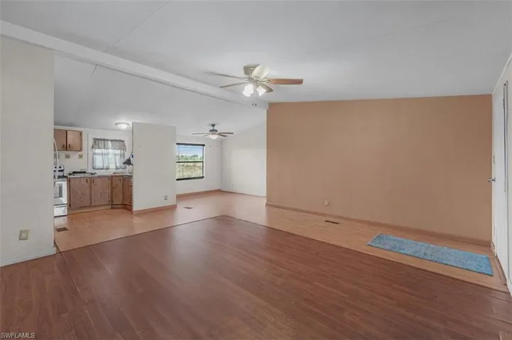 Unfurnished living room with light wood-style flooring