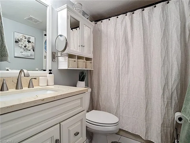Bathroom featuring vanity and tile patterned flooring