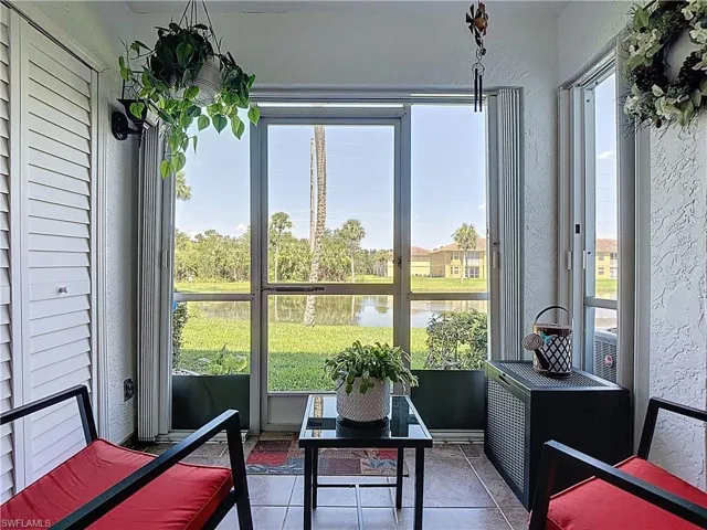 Sunroom with a water view