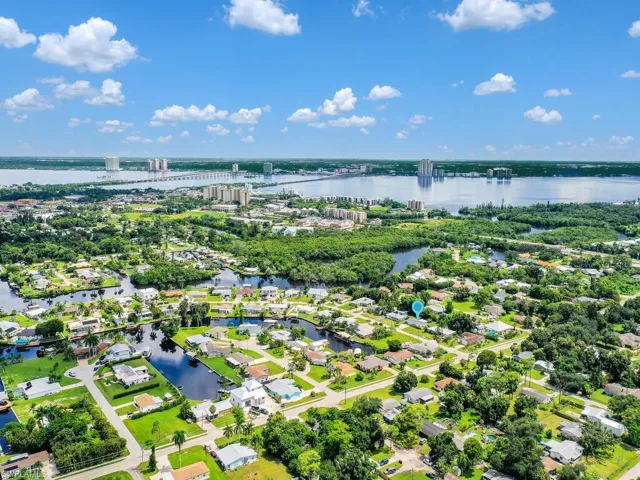 Drone / aerial view with a residential view and a water view