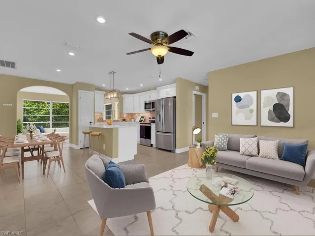Living room featuring visible vents, light tile patterned floors, recessed lighting, and a ceiling fan