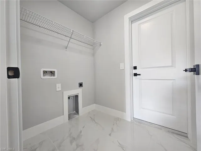 Laundry room featuring hookup for a washing machine and hookup for an electric dryer