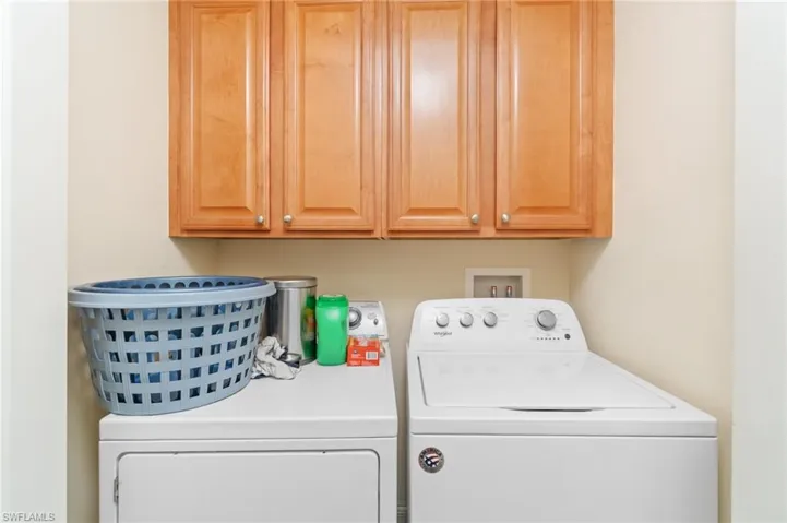 Laundry room with washer and dryer and cabinet space