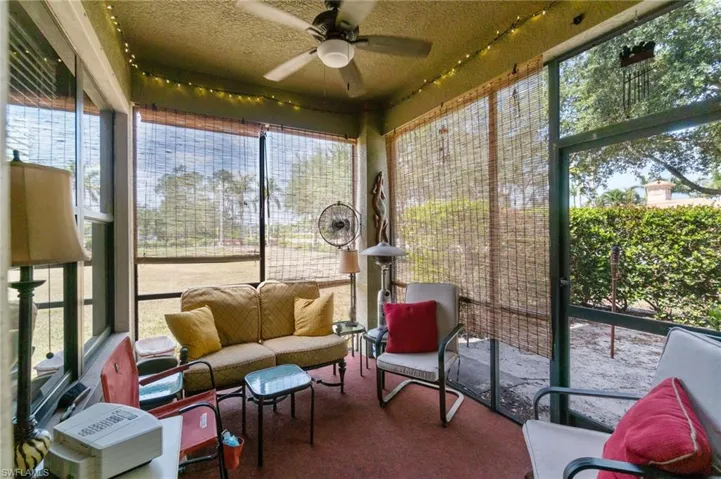 Sunroom featuring ceiling fan and an outdoor hangout area