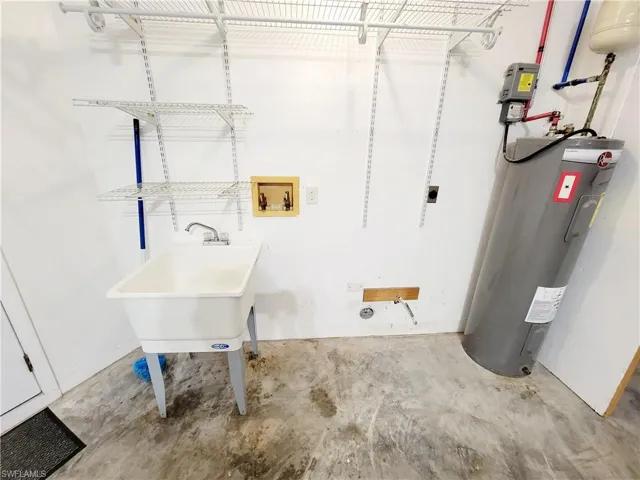 Laundry area inside garage