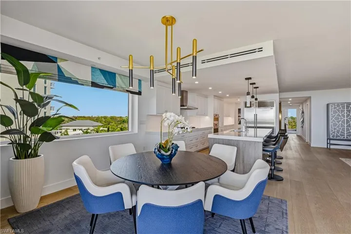 Dining area featuring light wood-style floors and recessed lighting