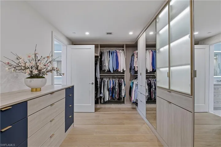 Walk in closet featuring light wood-style floors