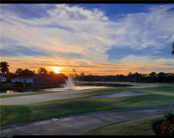 View of property's community with golf course view and a water view