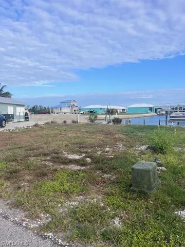 View of yard with a water view