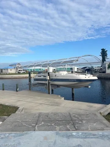 Dock with a water view and boat lift