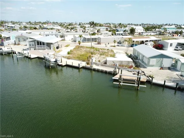 Aerial view of residential area with a large body of water