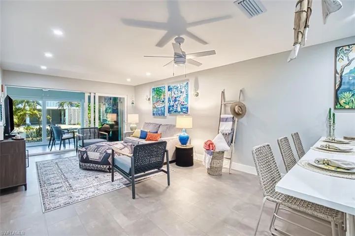 Livin room featuring recessed lighting, ceiling fan and fully furnished