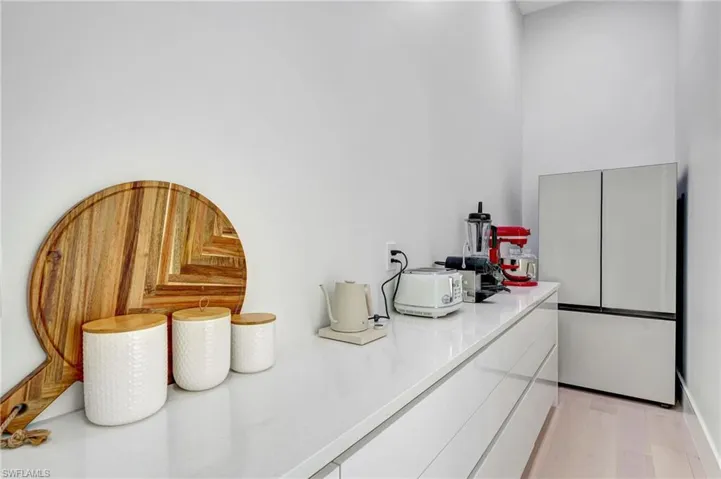Bar featuring light wood finished floors