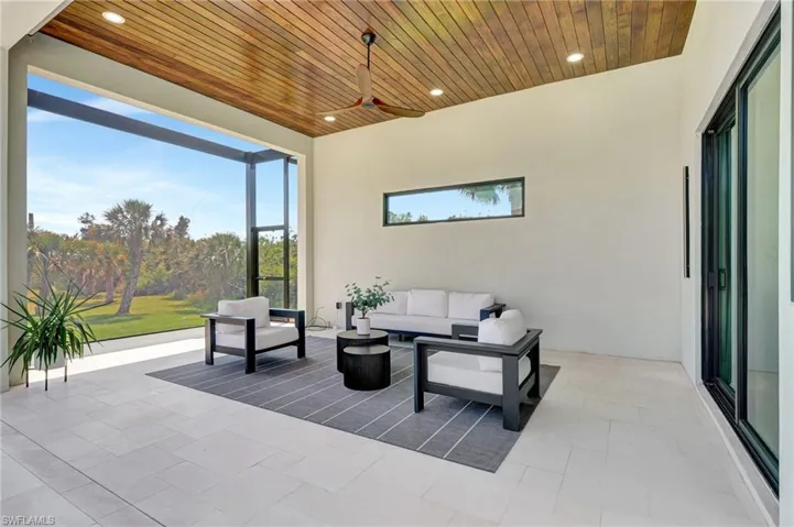View of patio / terrace featuring outdoor lounge area, a ceiling fan, and a lanai