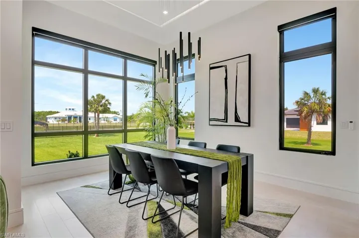Dining space featuring plenty of natural light and baseboards