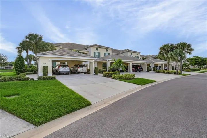 View of front of home with a front yard and a garage