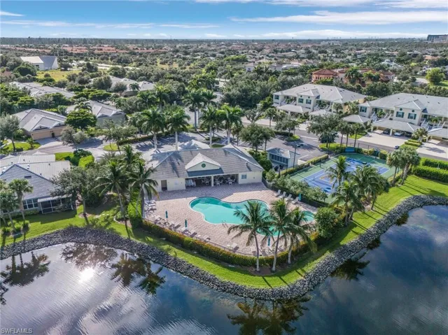 Birds eye view of property featuring a water view