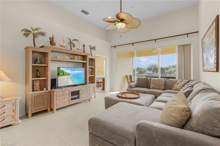 Tiled living room with ceiling fan