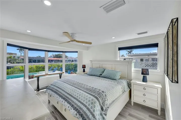 Retreat to your primary suite after a day of boating from your backyard!