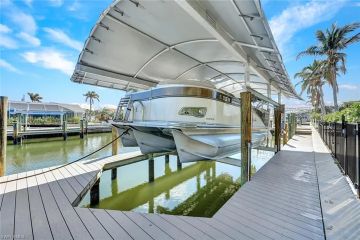 Privately owned covered boat lift in your backyard.