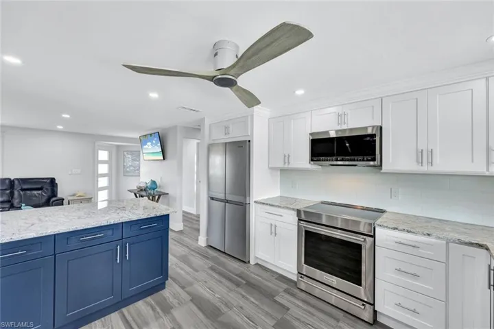 View of living room and entry way from the kitchen.