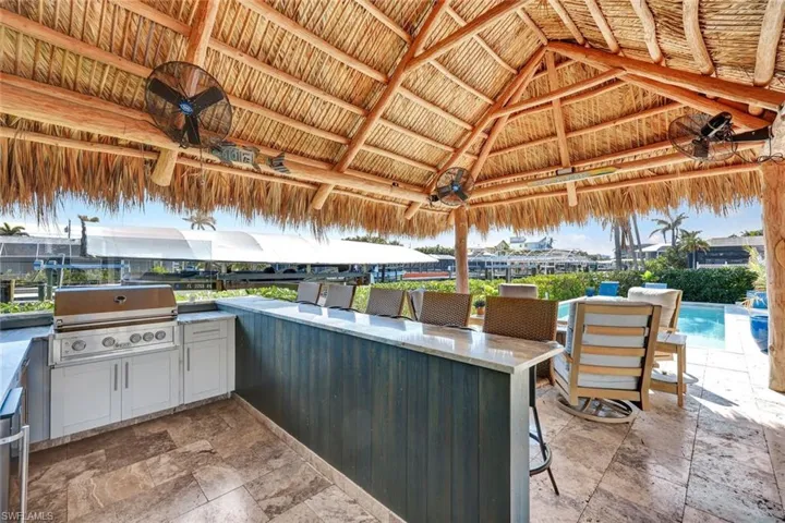 Notice the travertine pavers.
