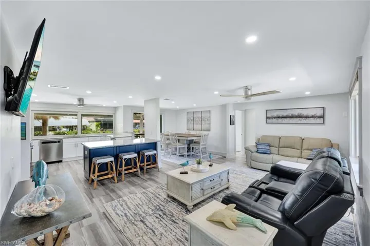 Living room, kitchen, and dining area are open to one another.