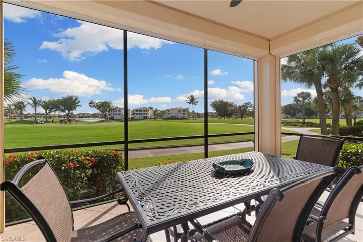 Sunroom featuring golf course view