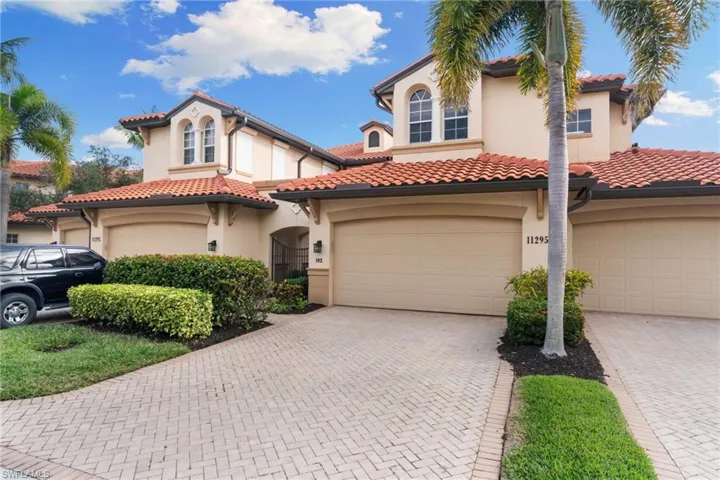 Mediterranean / spanish-style home featuring stucco siding, a garage, decorative driveway, and a tile roof