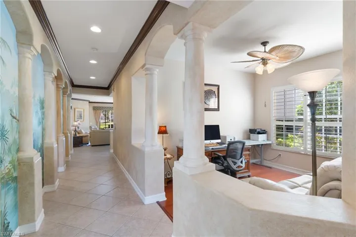 Office area with crown molding, ceiling fan, recessed lighting, built in study area, and light tile patterned floors