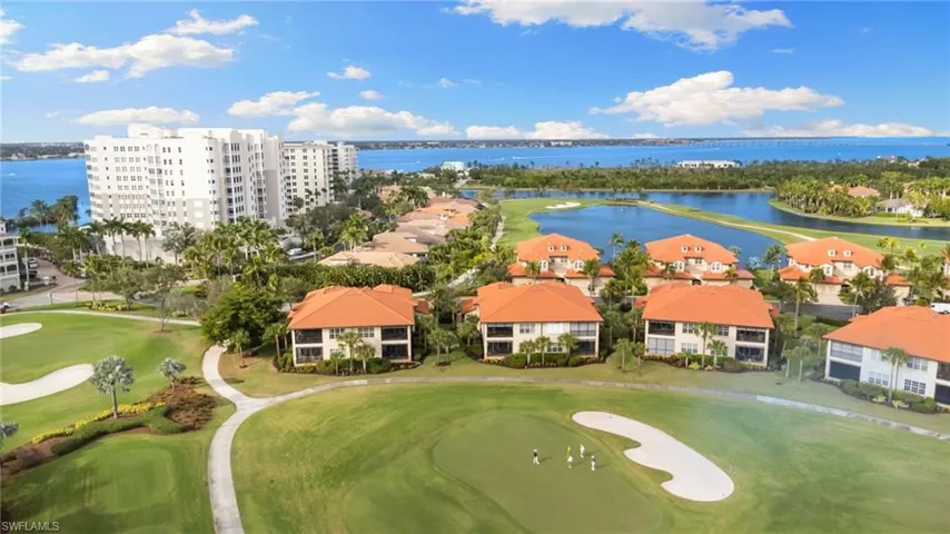 Bird's eye view of a nearby body of water and a golf club