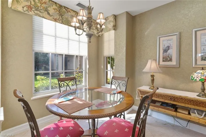 Dining space featuring a chandelier and tile patterned floors