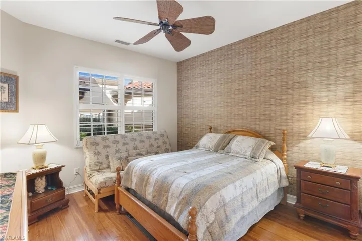 Bedroom featuring wood finished floors and a ceiling fan
