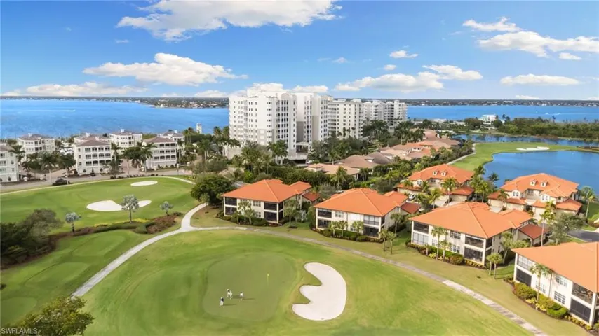 Bird's eye view of a large body of water and a local golf course