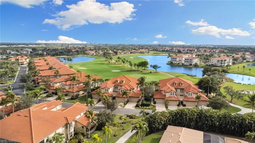 Aerial perspective of suburban area featuring a large body of water