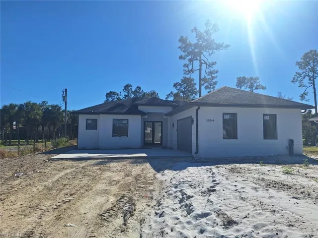 View of front of property featuring a garage
